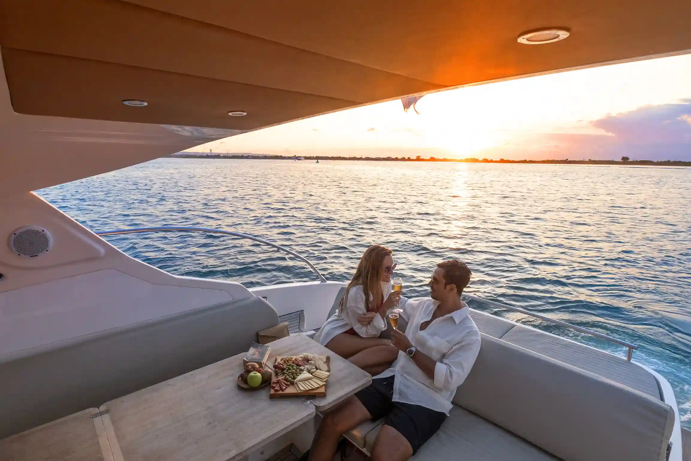 A motor yacht under way in clear water