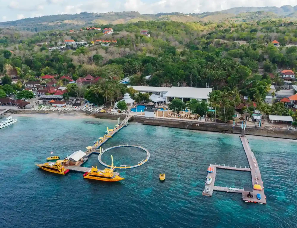 A beach club on the Nusa Penida shoreline at sunset