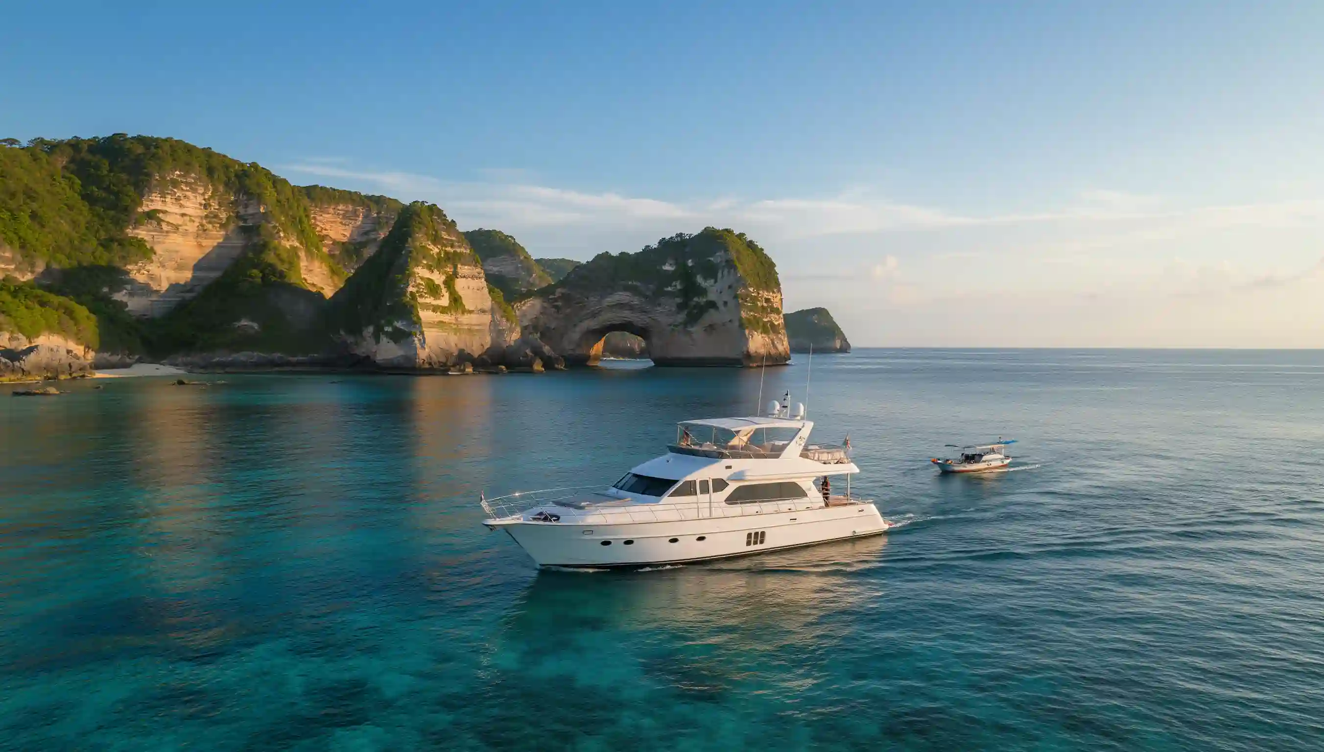 A charter yacht in clear water off the Nusa islands