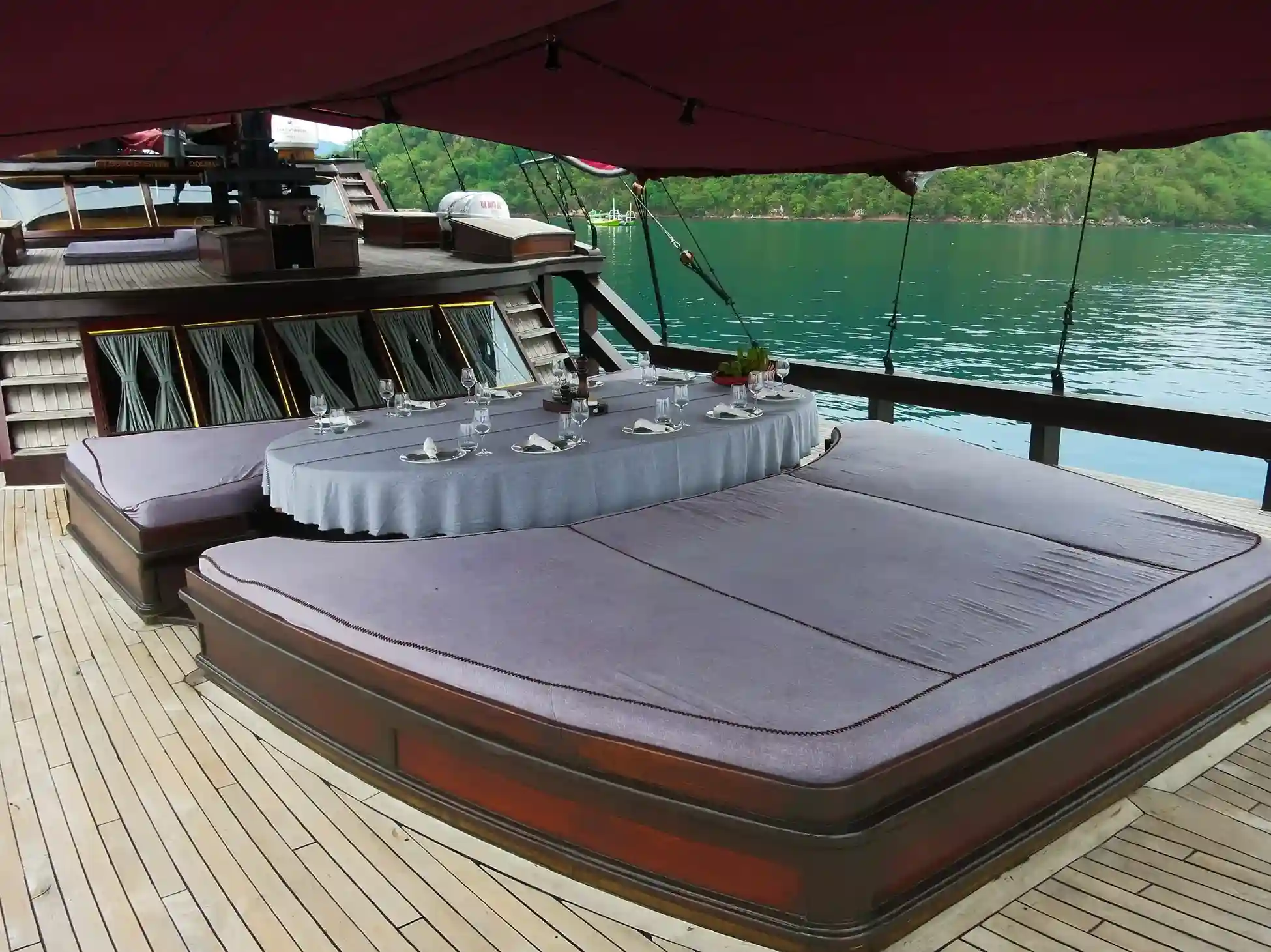 A table set for dinner on the deck of a yacht